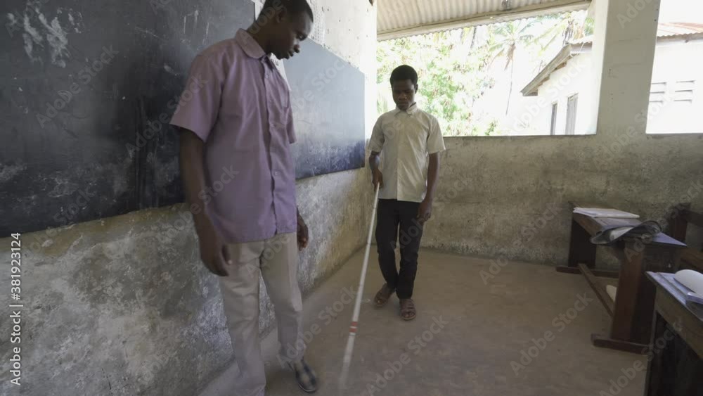 Teacher working with blind and partially sighted students. Africa Teacher working with blind and partially sighted students. Africa