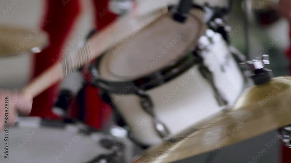 Close-up of drummer hitting cymbals and drum