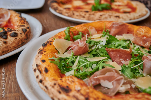 pizza with ham, rucola and cheese