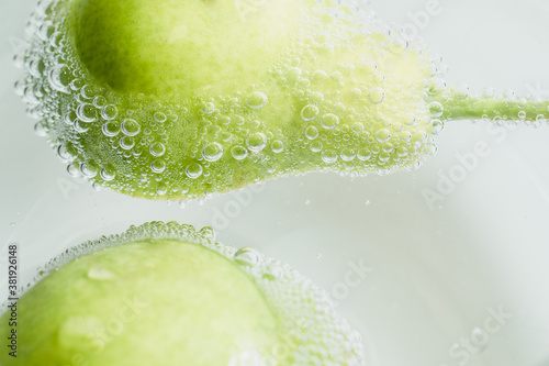Fresh fruits in water wiht air bubbles.