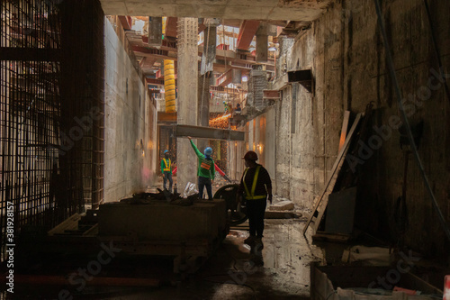 Concrete poles in the construction area, flakes from welding. Concept of working in tunnels and confined spaces