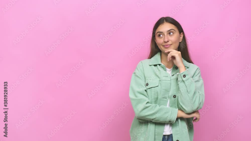 Young caucasian woman looking sideways with doubtful and skeptical expression