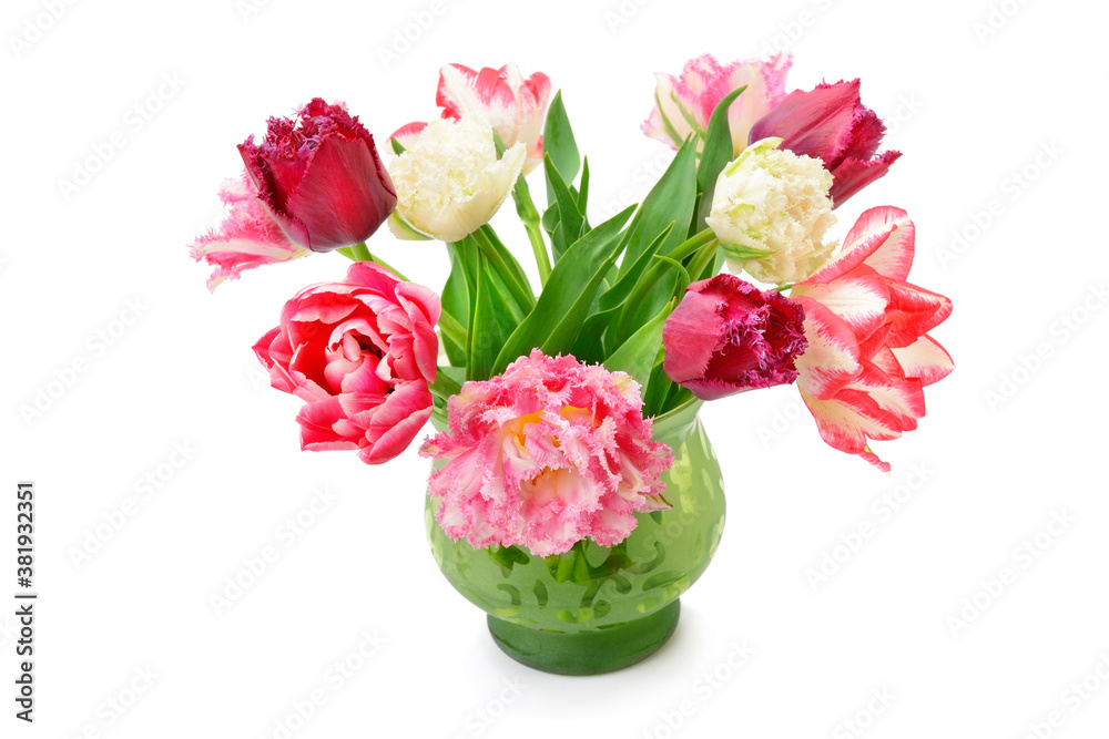 Tulips in a flower vase isolated on white background. Tulips in a flower vase isolated on white background.