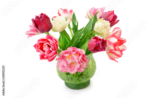 Tulips in a flower vase isolated on white background.