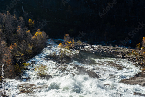 Autumnal Landscape in Norway with Flowing River © Nektarstock