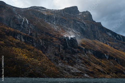 Rocky Cliffs with Waterfalls of Geirangerfjord Norway © Nektarstock