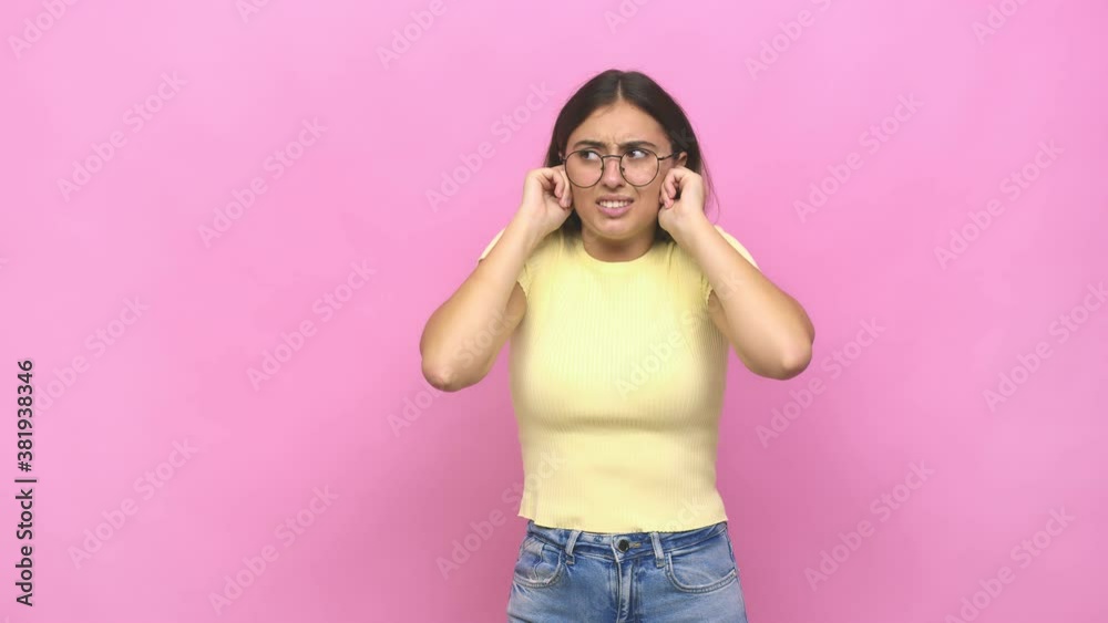 Young caucasian woman covering ears with hands Young caucasian woman covering ears with hands