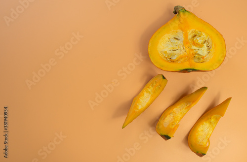 Creative layout made of pumpkin on the orange background. Flat lay. Food concept.