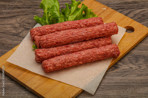 Raw beef sausages with spices