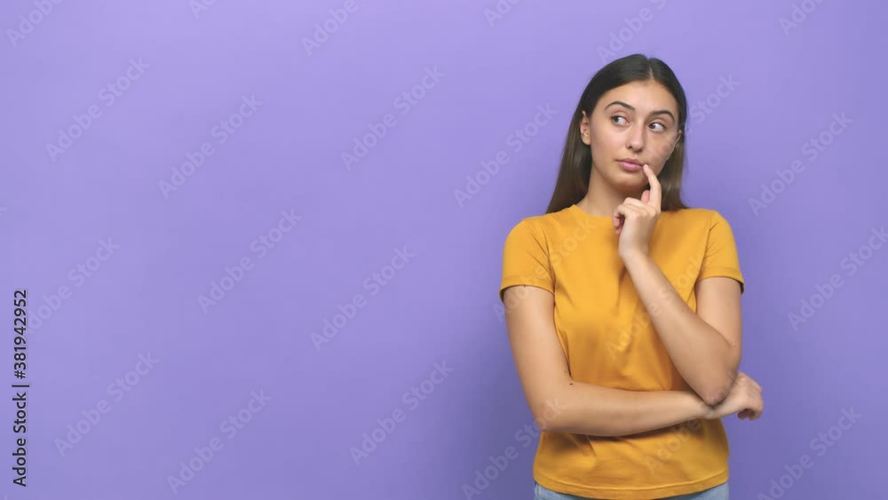 Young caucasian woman looking sideways with doubtful and skeptical expression