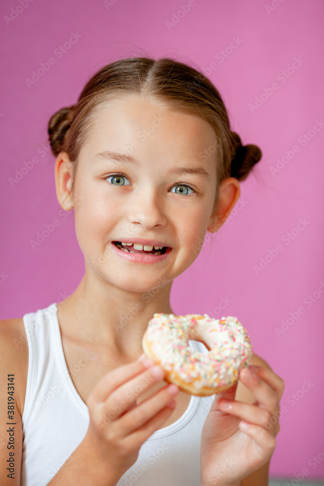 cute girl holding an appetizing glazed donut in her hands cute girl holding an appetizing glazed donut in her hands
