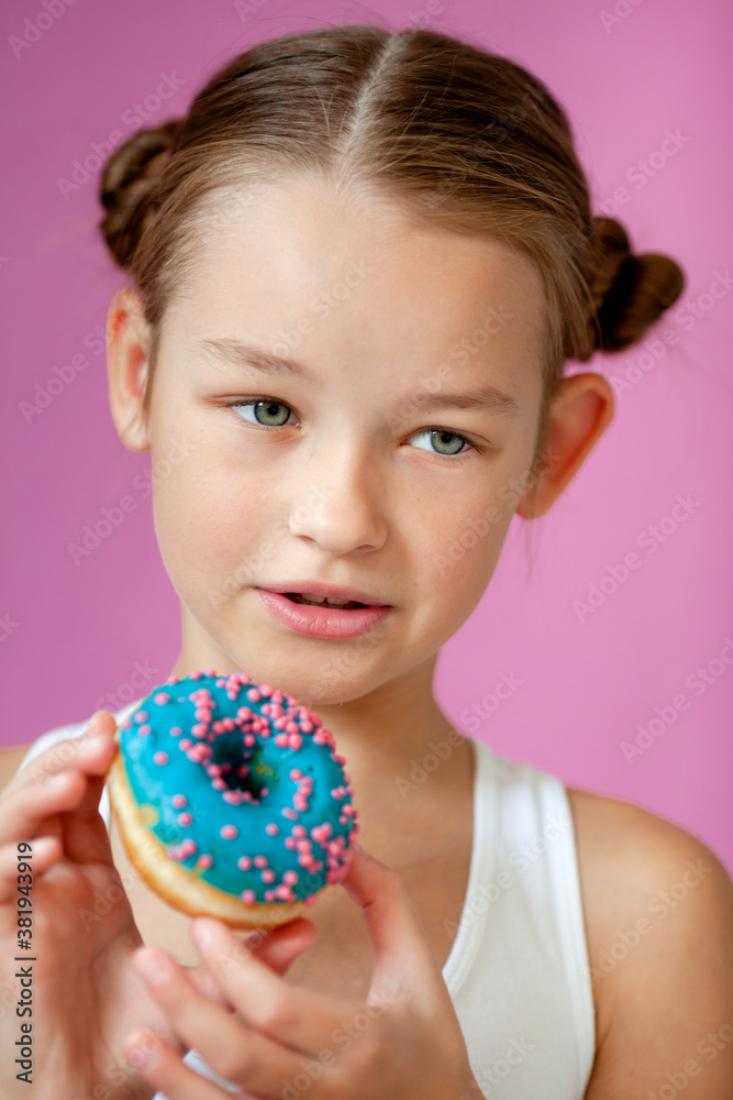 cute girl holding an appetizing glazed donut in her hands cute girl holding an appetizing glazed donut in her hands