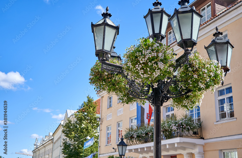 Street lamp with flowers in the old town