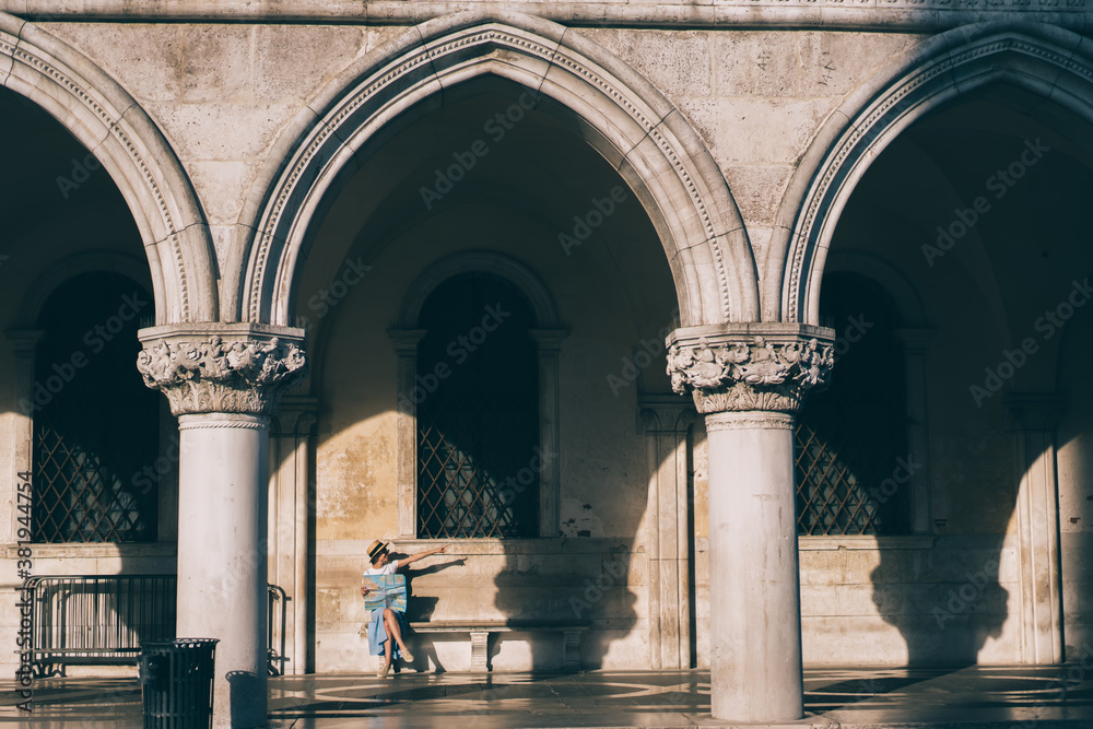 Woman with map pointing at location direction Woman with map pointing at location direction