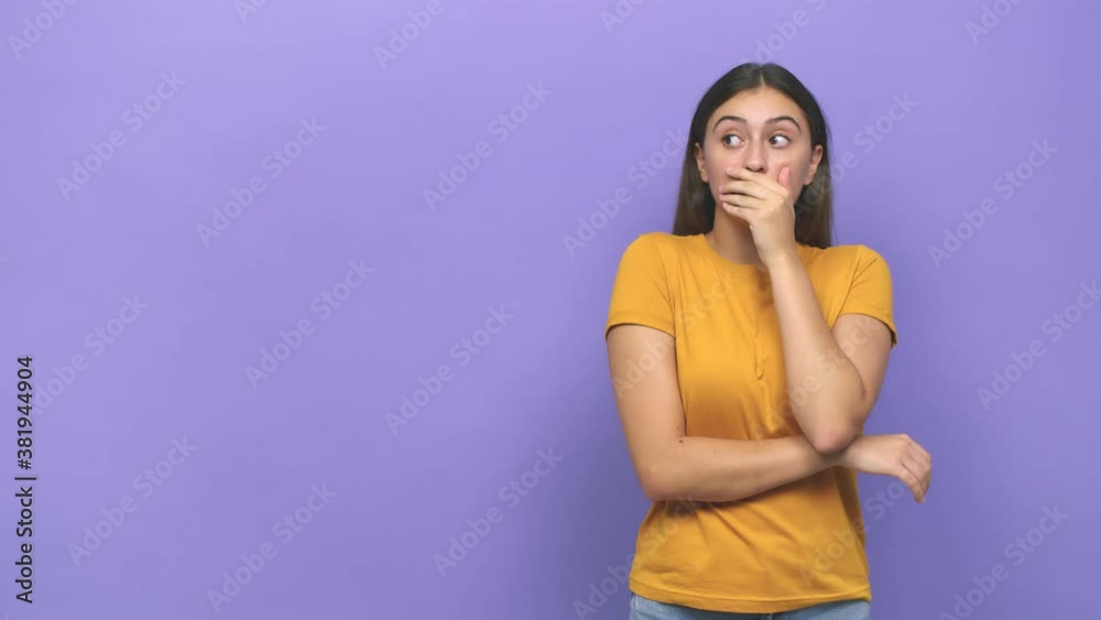 Young caucasian woman thoughtful looking to a copy space covering mouth with hand Young caucasian woman thoughtful looking to a copy space covering mouth with hand