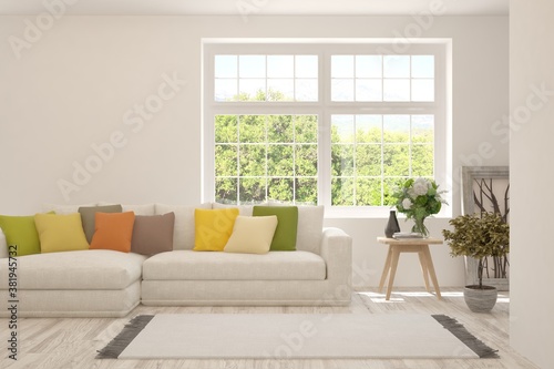 White living room with sofa and summer landscape in window. Scandinavian interior design. 3D illustration © AntonSh