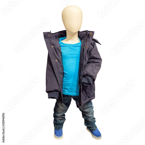 Small white mannequin in baby clothes on a white background photo