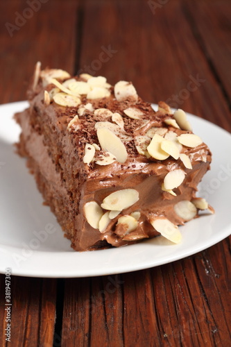 Chocolate sandwich cake garnished with flaked almonds