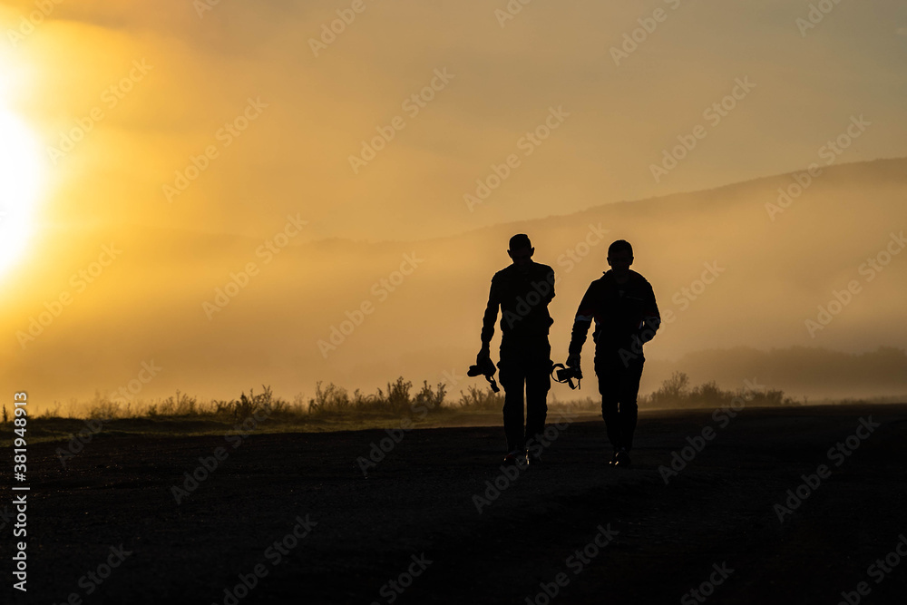 couple walking in the sunset