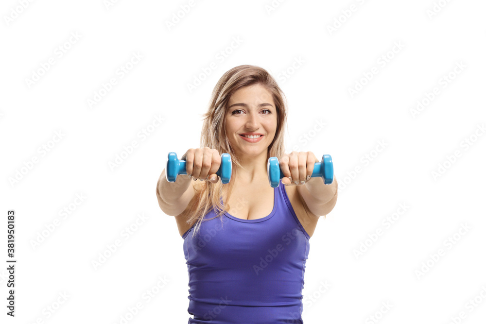 Woman exercising with dumbbells and smiling Woman exercising with dumbbells and smiling