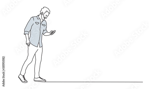 Man with beard using phone.