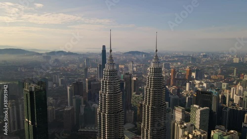 Aerial view flight upward of Kuala Lumpur City Center in the morning. 