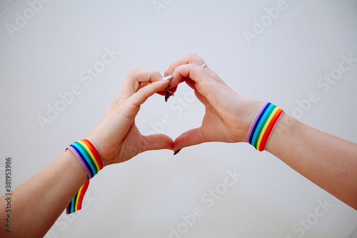 Womens making hand heart with gay pride rainbow colors sport wristbands