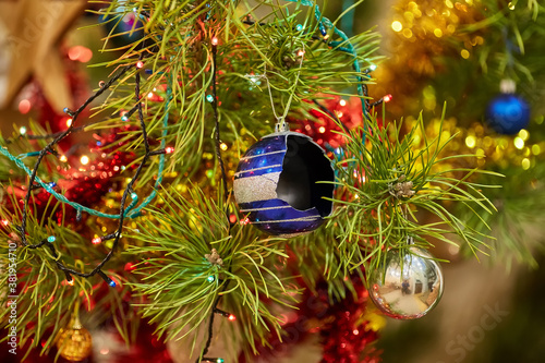 christmas tree with a broken blue glass ball photo