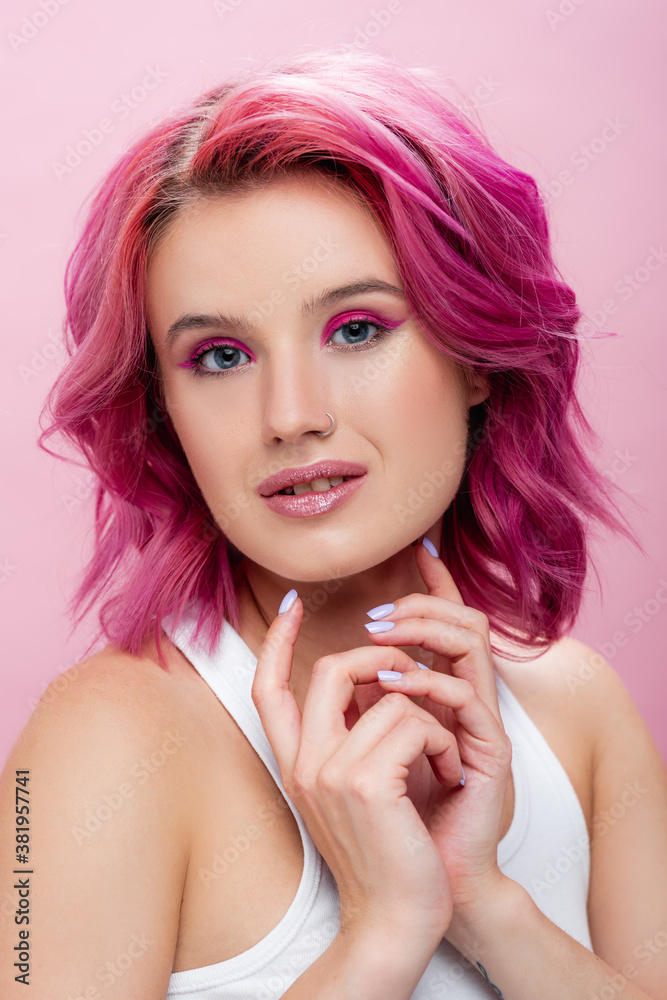young woman with colorful hair and makeup posing isolated on pink young woman with colorful hair and makeup posing isolated on pink