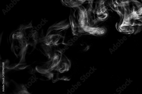 White natural steam smoke effect on solid black background with abstract blur motion wave swirl use for overlay in vapor cigarette, hot boil food and water 