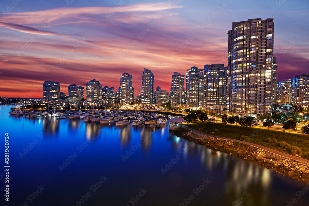 Skyline of apartments in Vancouver with red sunset sky at dusk