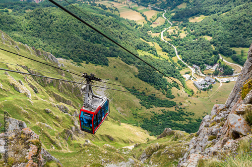 Cable car of Fuente Dé, in the National Park of Picos de Europa, between Cantabria and Asturias, Spain Cabin of the funicular descending through the cables, towards the station of the valley.