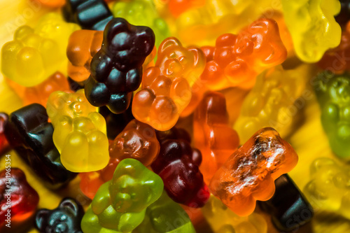 Many sweet and tasty gummy bears close-up.
