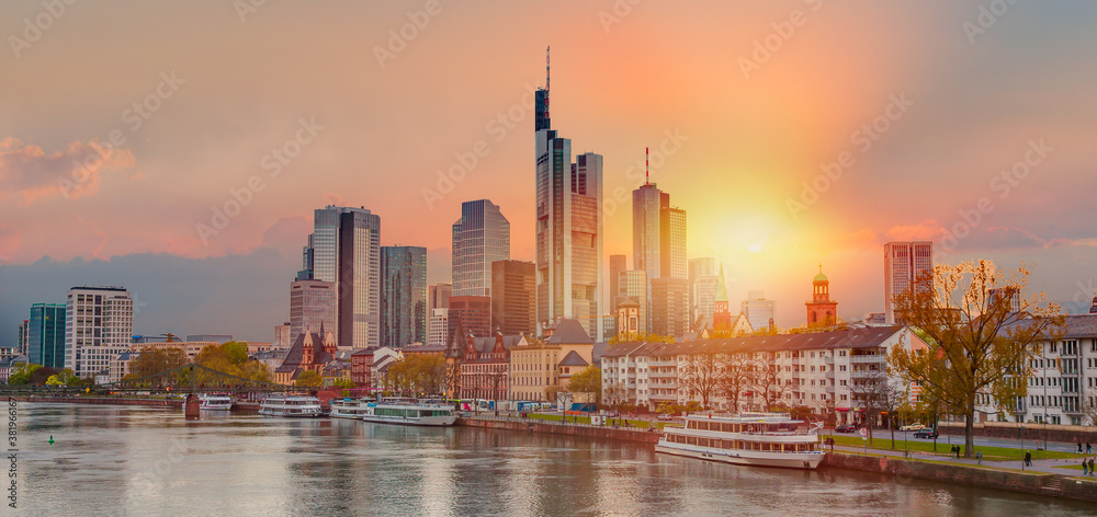 Skyline over the Main River at sunset - Frankfurt is the financial center of the country, Germany