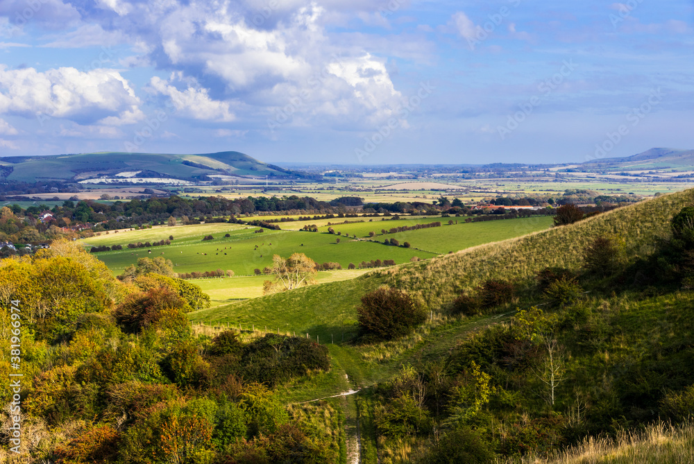 Ascending the Kingston ridge on the south downs near Lewes east Sussex with magnificent views east over the countryside Ascending the Kingston ridge on the south downs near Lewes east Sussex with magnificent views east over the countryside