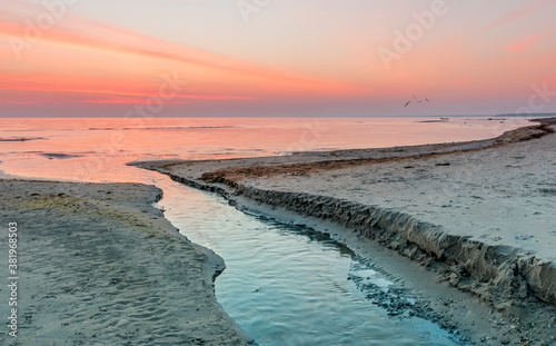 Small brook and its estuary< seascape before sunrise, Baltic Sea, Europe