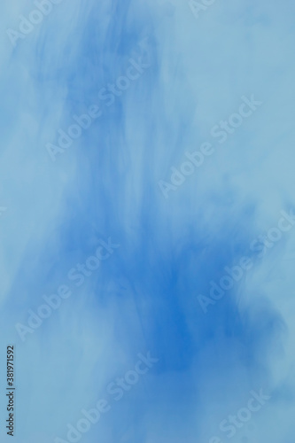 Blue abstract vertical background of smooth liquid veil