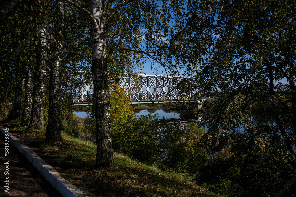 bridge over the river and the reflection of the metal railway bridge in the river bridge over the river and the reflection of the metal railway bridge in the river