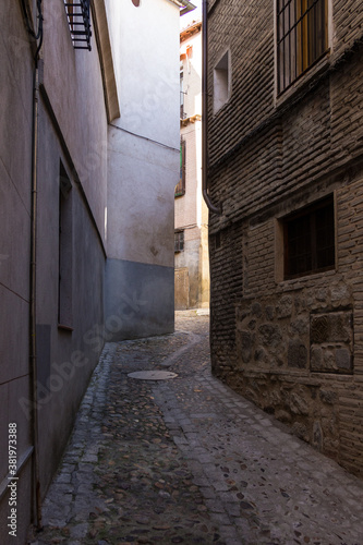 Around a corner and down a medieval street in an ancient Spanish town on sunny day © Richard