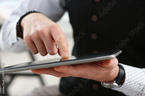 Male arm point finger using tablet pc display closeup. Stock market student management time chat addict electronic bank modern lifestyle job plan share blog tweet mania news web application © H_Ko