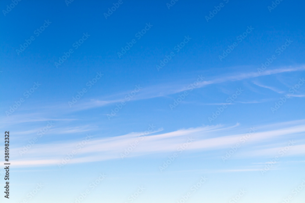 Blue sky with stripes of cirrus clouds at daytime Blue sky with stripes of cirrus clouds at daytime