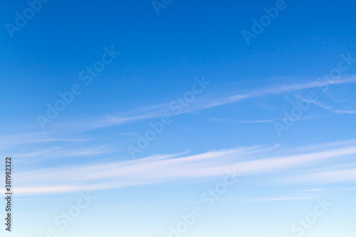 Blue sky with stripes of cirrus clouds at daytime