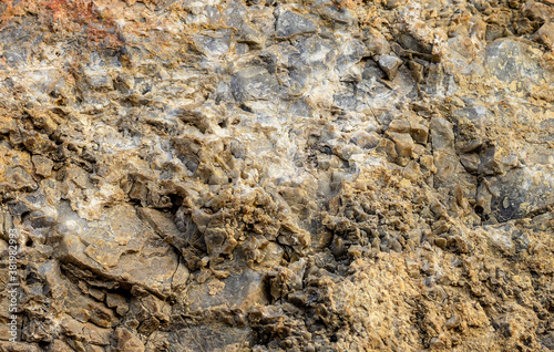 Granular surface of limestone rock. Stone rock surface. Limestone texture. Rock surface pattern of limestone stone. Stone background with text copy space