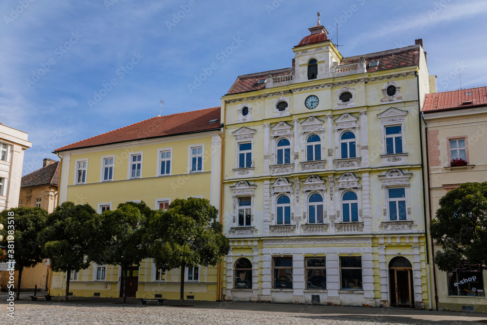 Colorful historical buildings in the center of Duchcov in sunny day. Duchcov, Northern Bohemia, Czech Republic