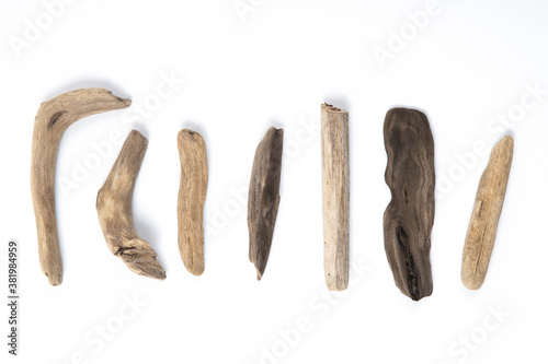 Set of different sizes and forms driftwood sticks isolated on white background. Natural materials.
