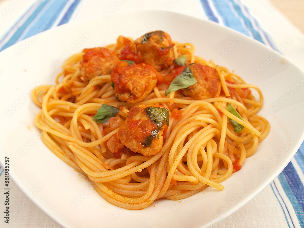 Spaghetti with meatballs in tomato sauce