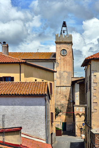 Historic clock tower in the city of Magliano in Toscana photo