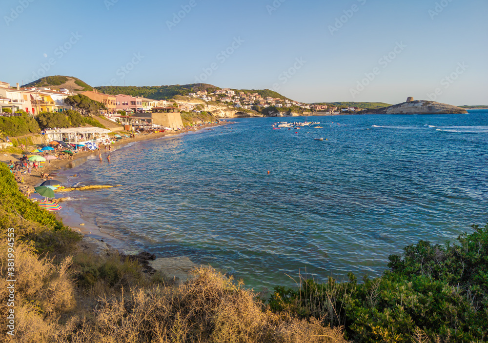 S'Archittu (Italy) - The little arch, in the Sardinian language, is a small coastal touristic town in province of Oristano, Sardinia region and island. Here a view at sunset.