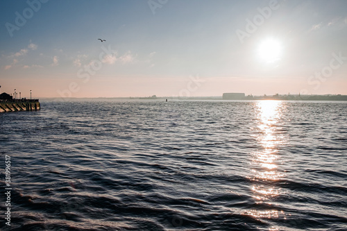Liverpool, UK. Beautiful colorful long exposure shot of river Mersey from Albert Dock with smooth reflections of night lights from the other side of a shore. 