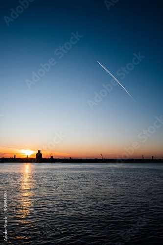 Liverpool, UK. Beautiful colorful long exposure shot of river Mersey from Albert Dock with smooth reflections of night lights from the other side of a shore. 
